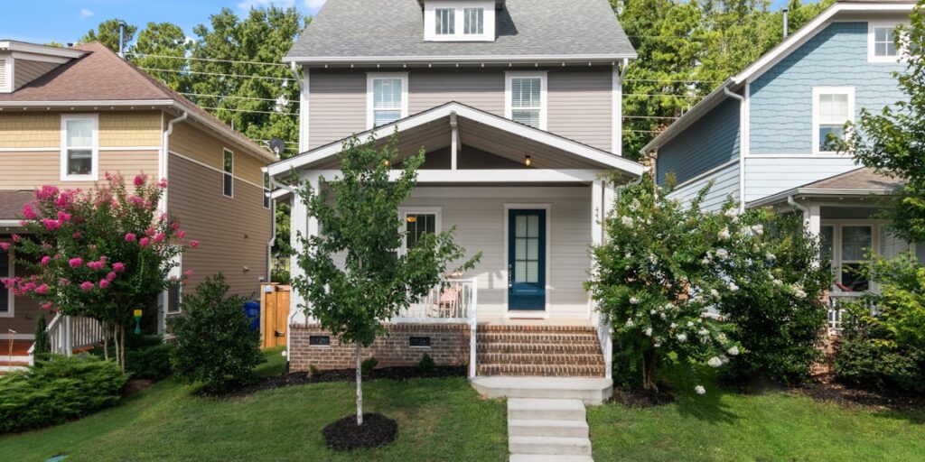 Charming suburban home exterior with front porch and landscaping