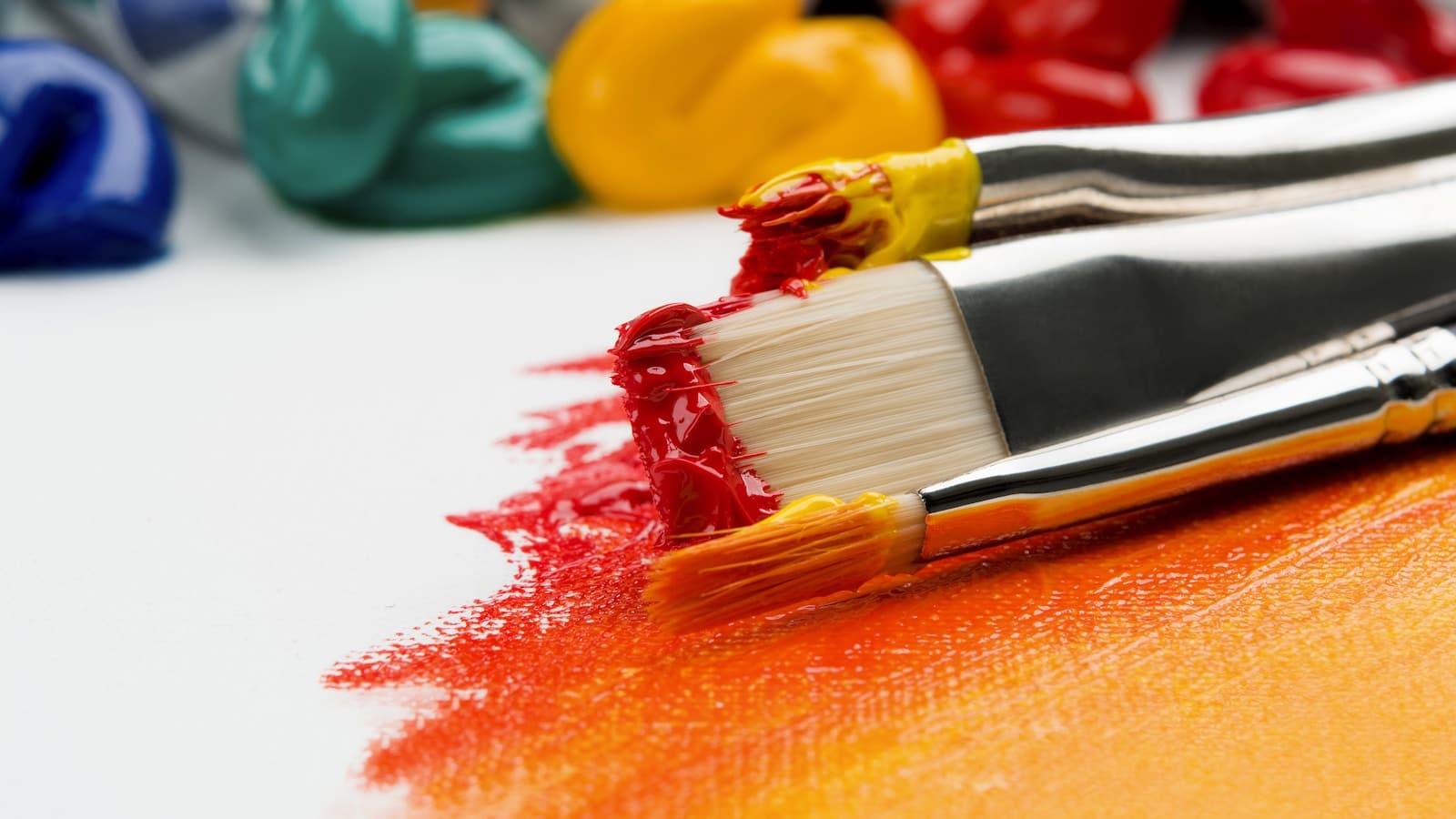 Colorful paintbrushes and paint representing art therapy and creative expression