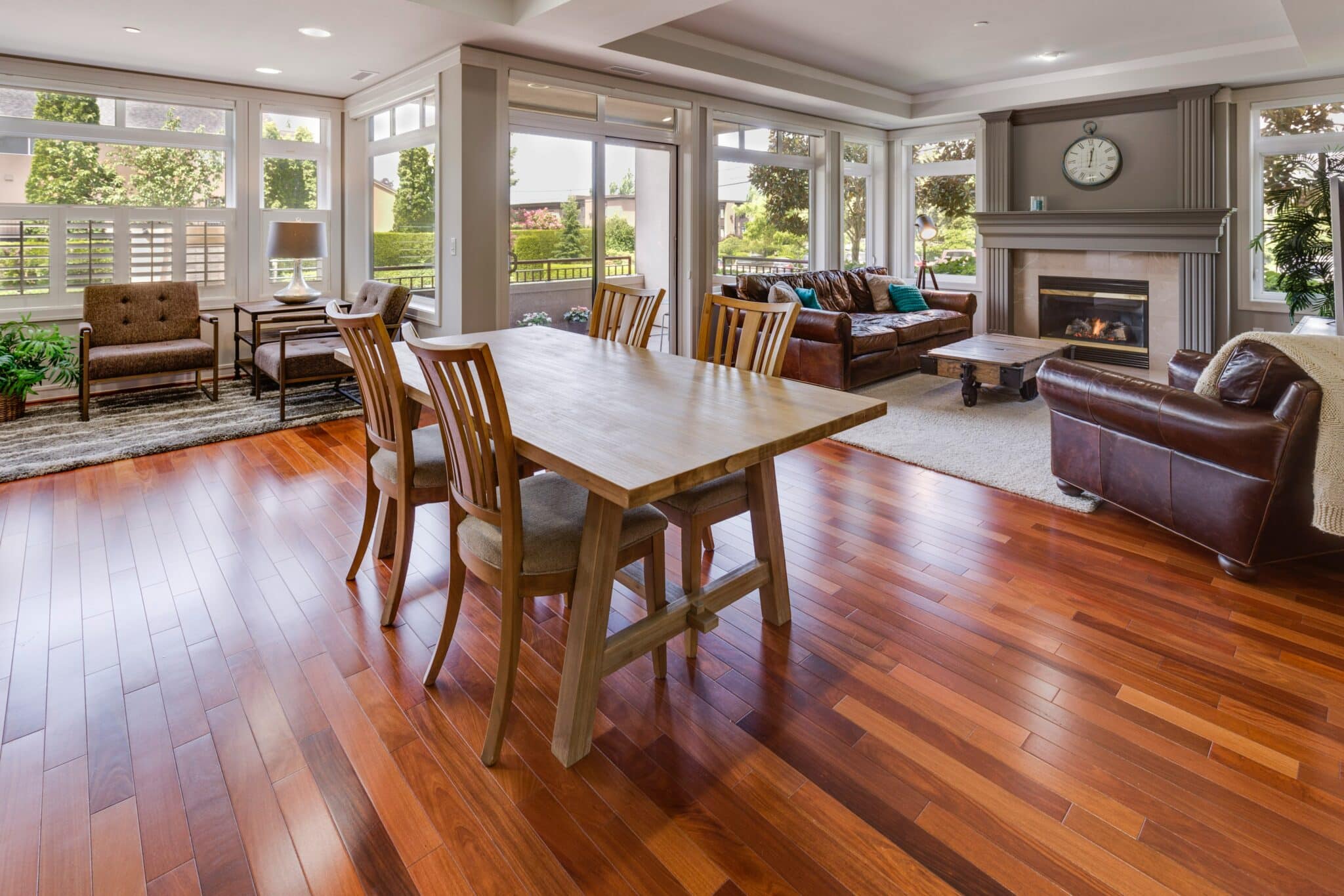 Open concept living and dining area with gleaming hardwood floors